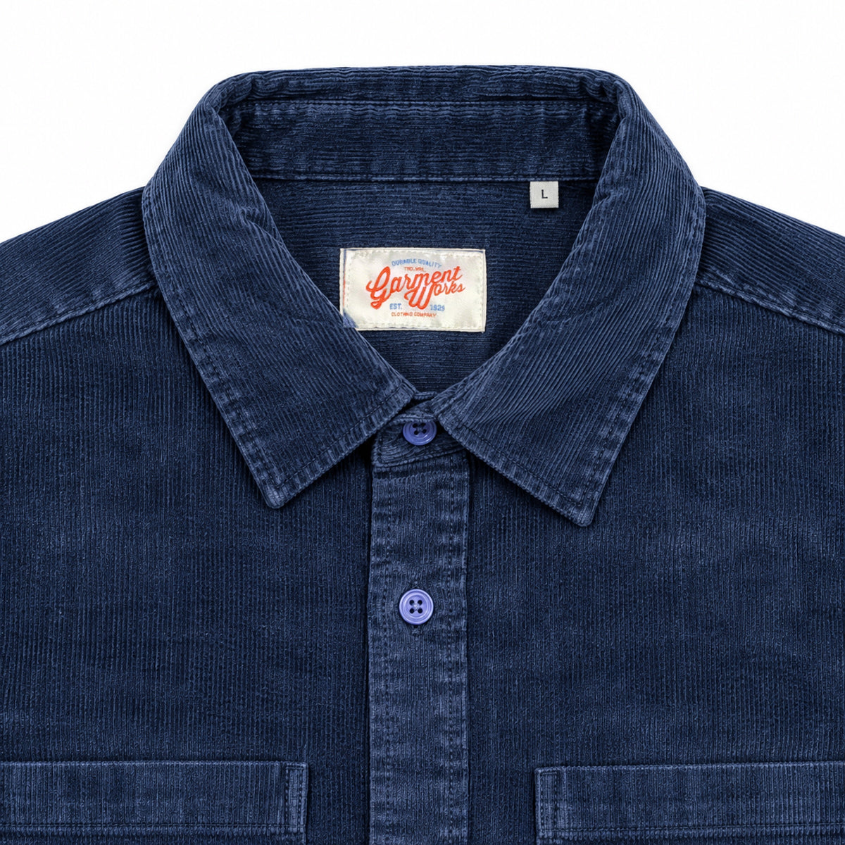 Close-up of blue corduroy shirt collar and Garment Works woven label