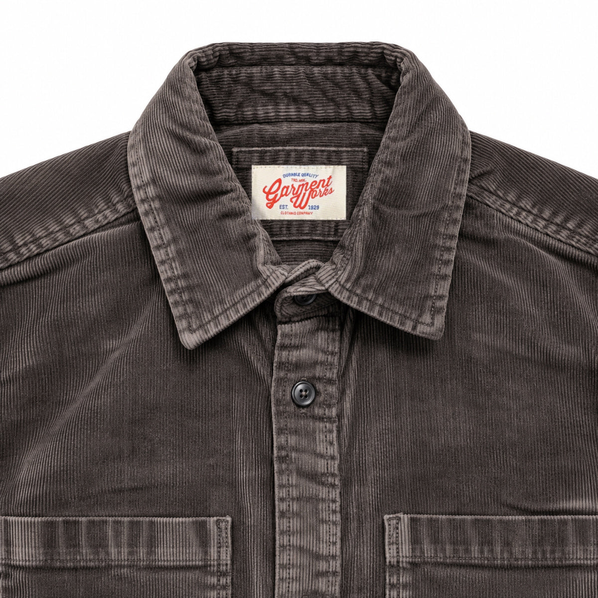 Close-up of dark brown corduroy shirt collar and Garment Works woven label