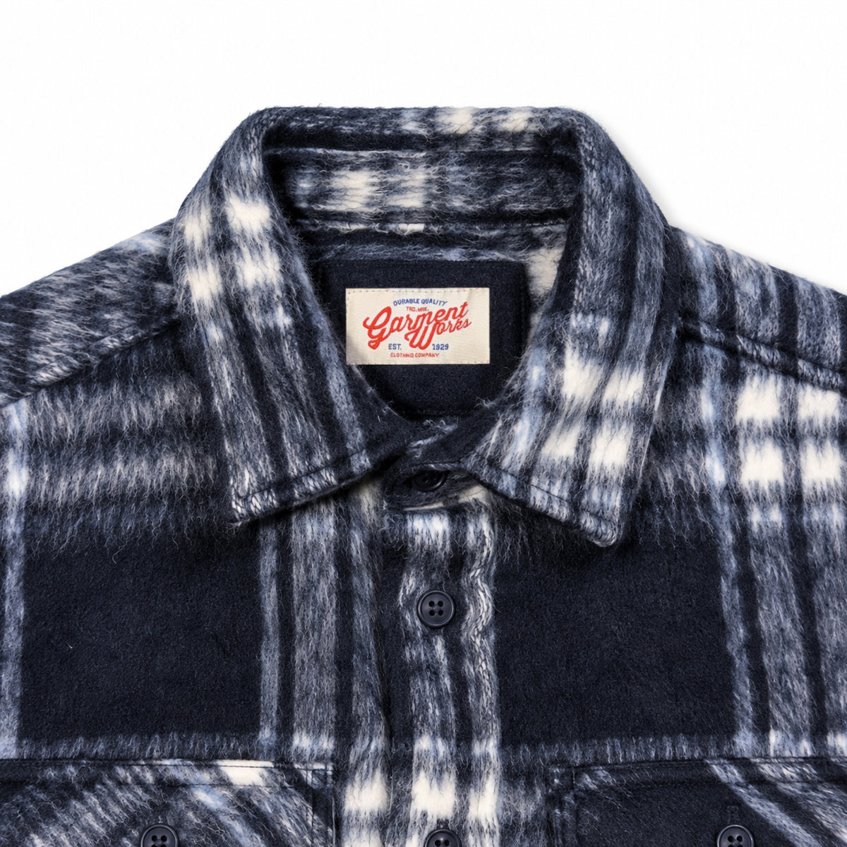 Close-up of navy check overshirt collar and Garment Works woven label